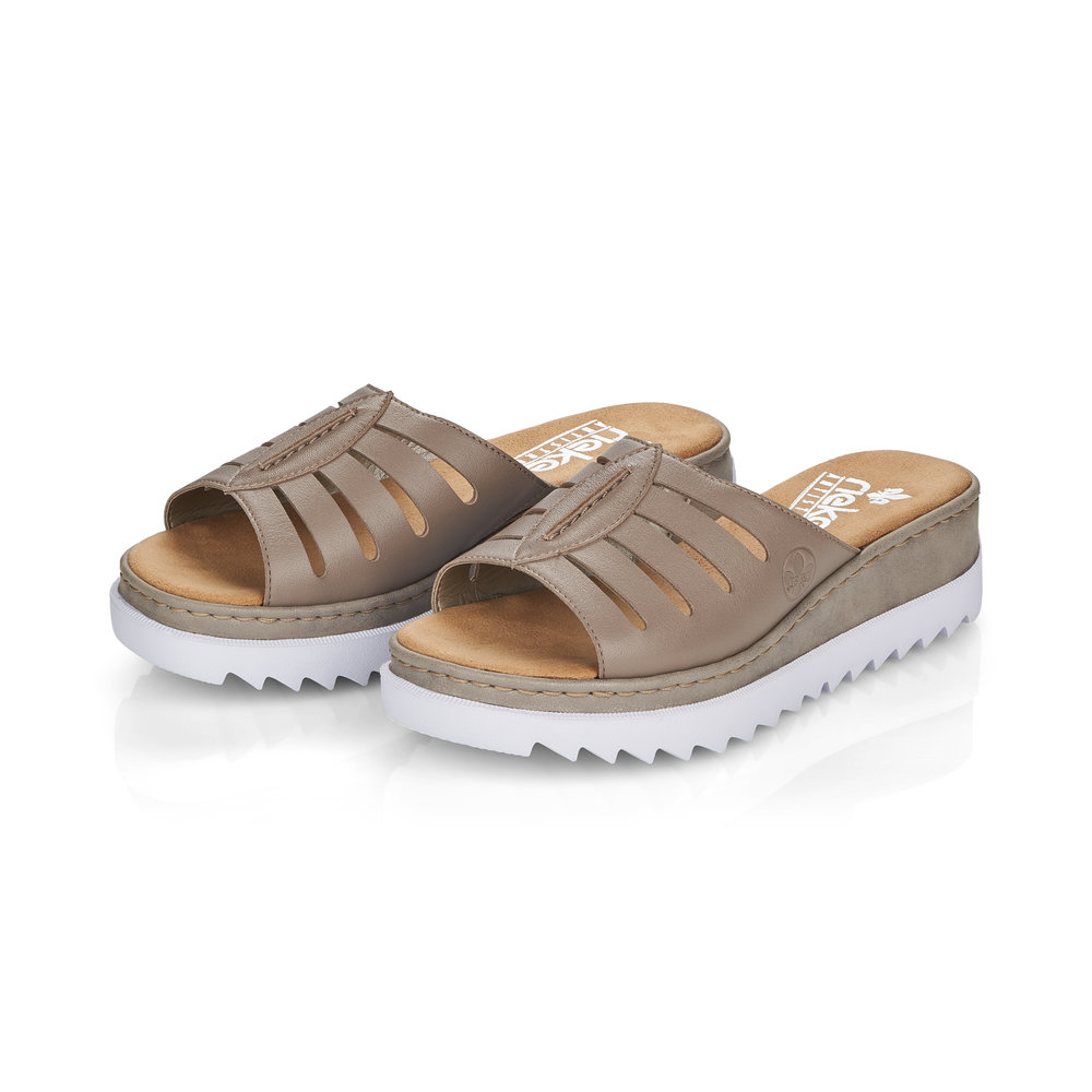 Бежевые сабо из кожи на танкетке Rieker